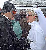 Snow drifted past the lovers' gaze as they spoke vows. (Photo: Loveland Ski Area)