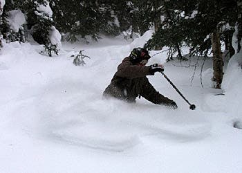 A skier enjoys the pure powder (28 inches of it) in the Black Hole.Photo Courtesy of Smugglers' Notch