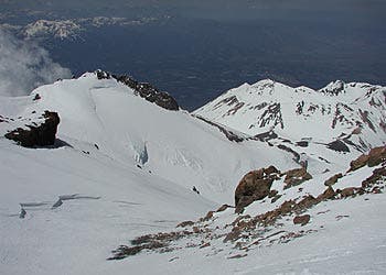 Mount Shasta The view looking down at Shastina and the top of the Whitney Glacier from Misery Hill at about 13,000 feet. PHOTO: NASTC