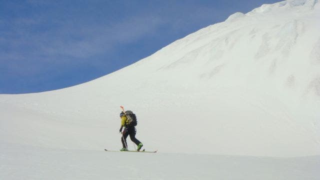 Guide Jason Mack ascending glacier on northeast-facing shore of Cierva Cove.