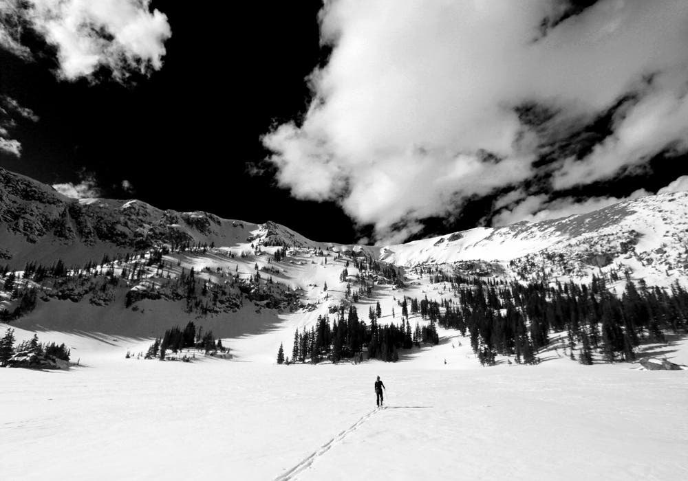 Crossing Forest Lakes Emily Templin Lesh crossing Forest Lakes at 10900 feet. We would ski the bowl straight ahead.