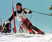 That’s Skiing Magazine contributor Kelly Bastone finding some cold snow underneath the orange granite of Mount Hayburn.