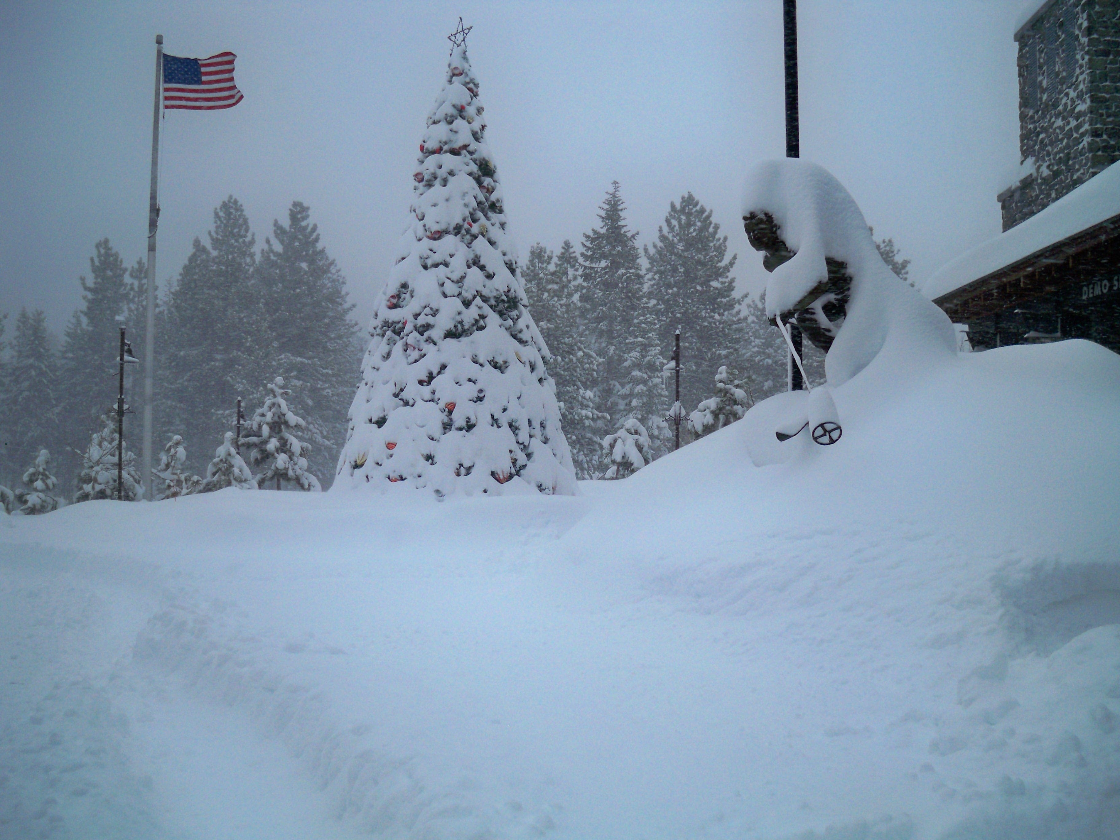 On Saturday, this statue of Mammoth Mountain's founder Dave McCoy was skiing knee-deep.