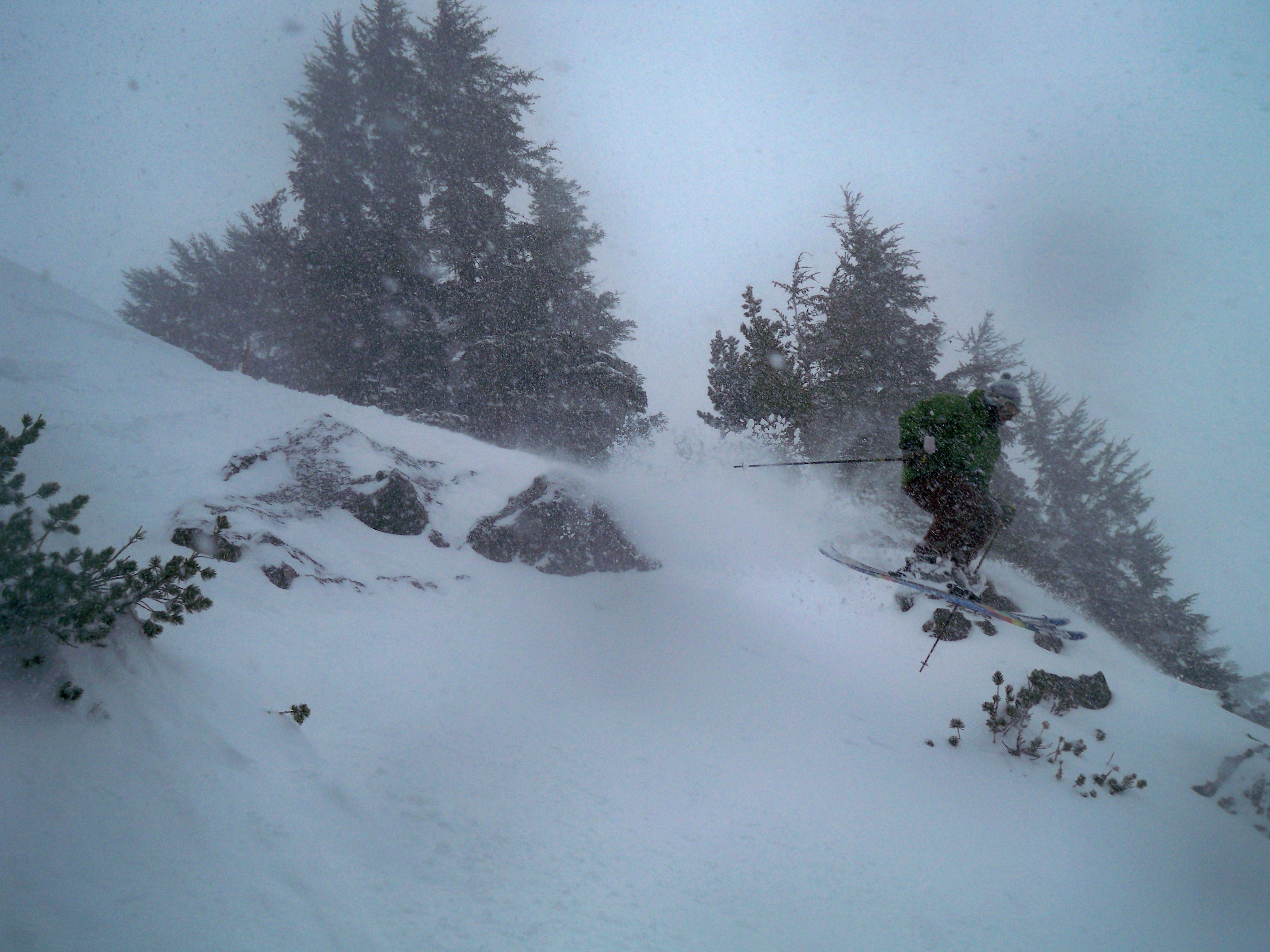 Getting sick with it. Locals don't start jumping cliffs till the snow base reaches 7 feet. Kevin decides to take his chances at 6.5.