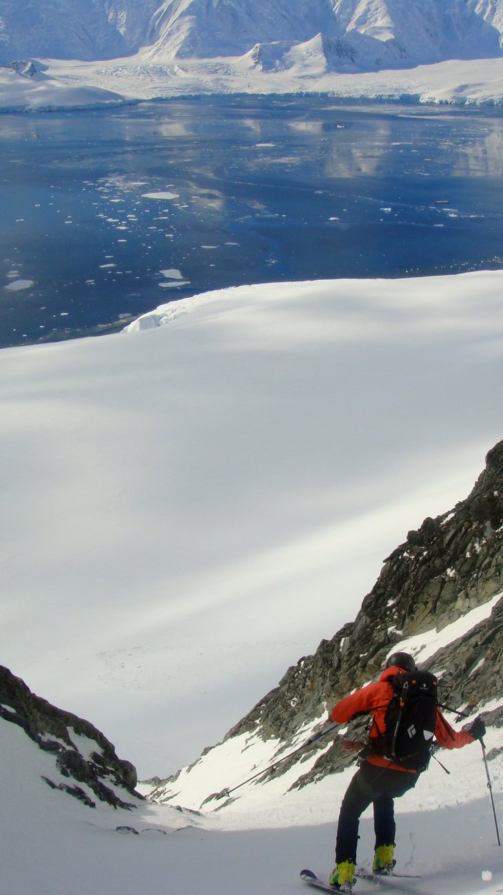 Another from the Dogleg Steve continues down the dogleg chute with the base of 9,600-foot Mt. Francois visible across the Neumayer Channel.