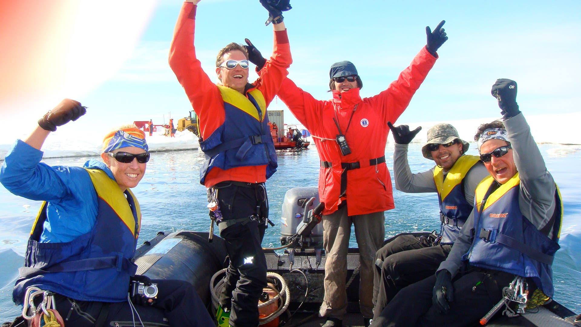 As we head back shipward, we take a moment to celebrate. Behind us, a crew of Chilean longshoremen offload supplies for a nearby base.