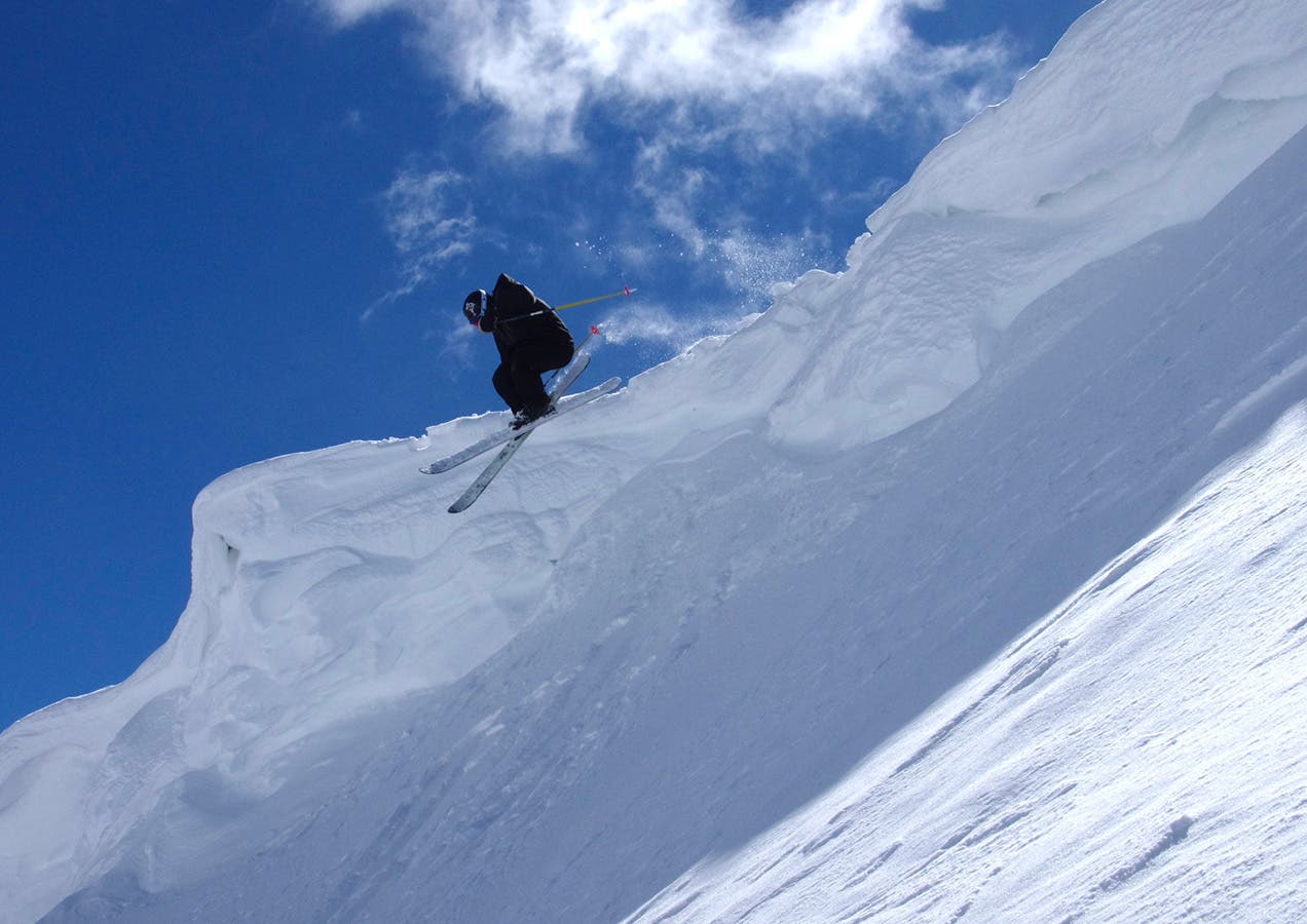 Testers love cornices like dogs love trucks. Skier: Doug Evans