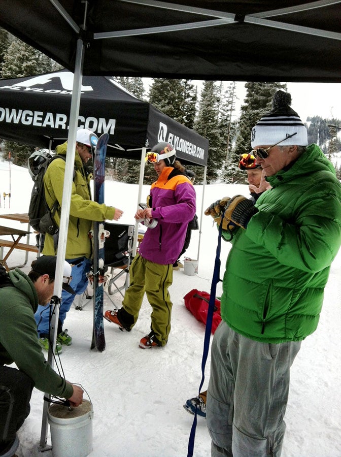 Setting Up Mike Kilchenstein (foreground) of Ramp Sports fiddles with his seatbelt while editor Kevin Luby sets the wind weights. Behind, Mike McCabe and Ryan…