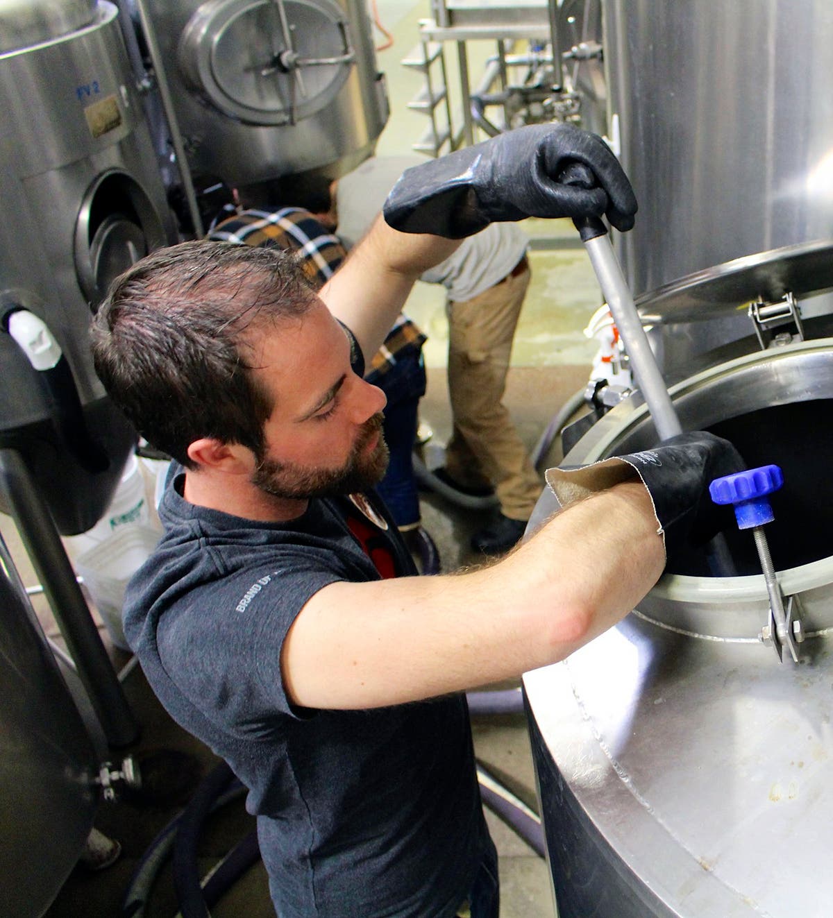 With everything mixed in and boiled to perfection, it was time to transfer the wort to the holding barrel. One final stir and we sent our beer off to…