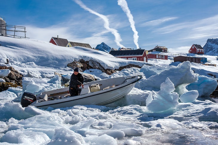 SKG1216_PHO8_Greenland A typical traffic jam in the Semilik Fjord. “This is my favorite photo of the whole trip,” Long says. ”Tobias was ‘the man’ in town. He knew…
