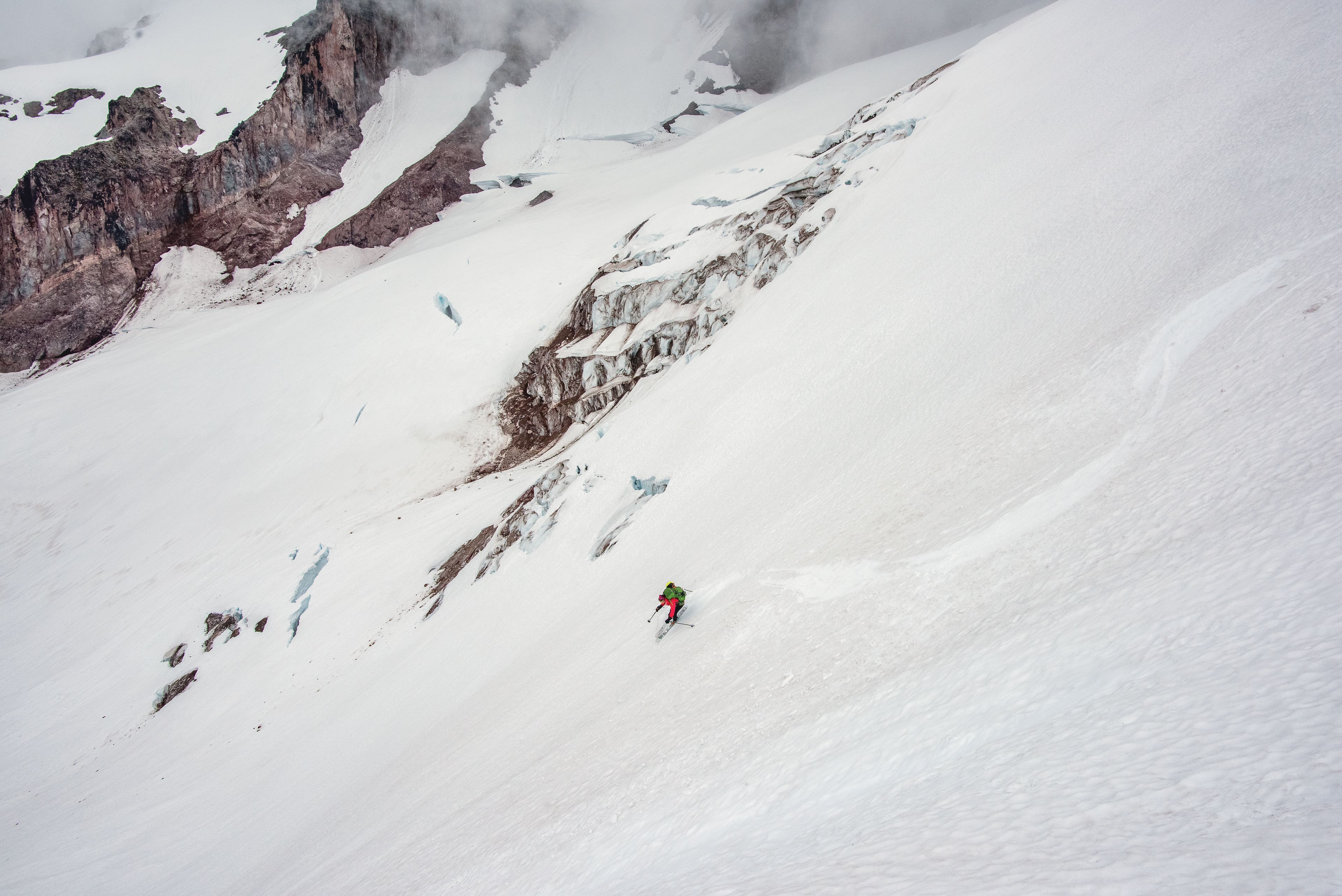 Kimberly Ann carves tracks down Scimitar Glacier.