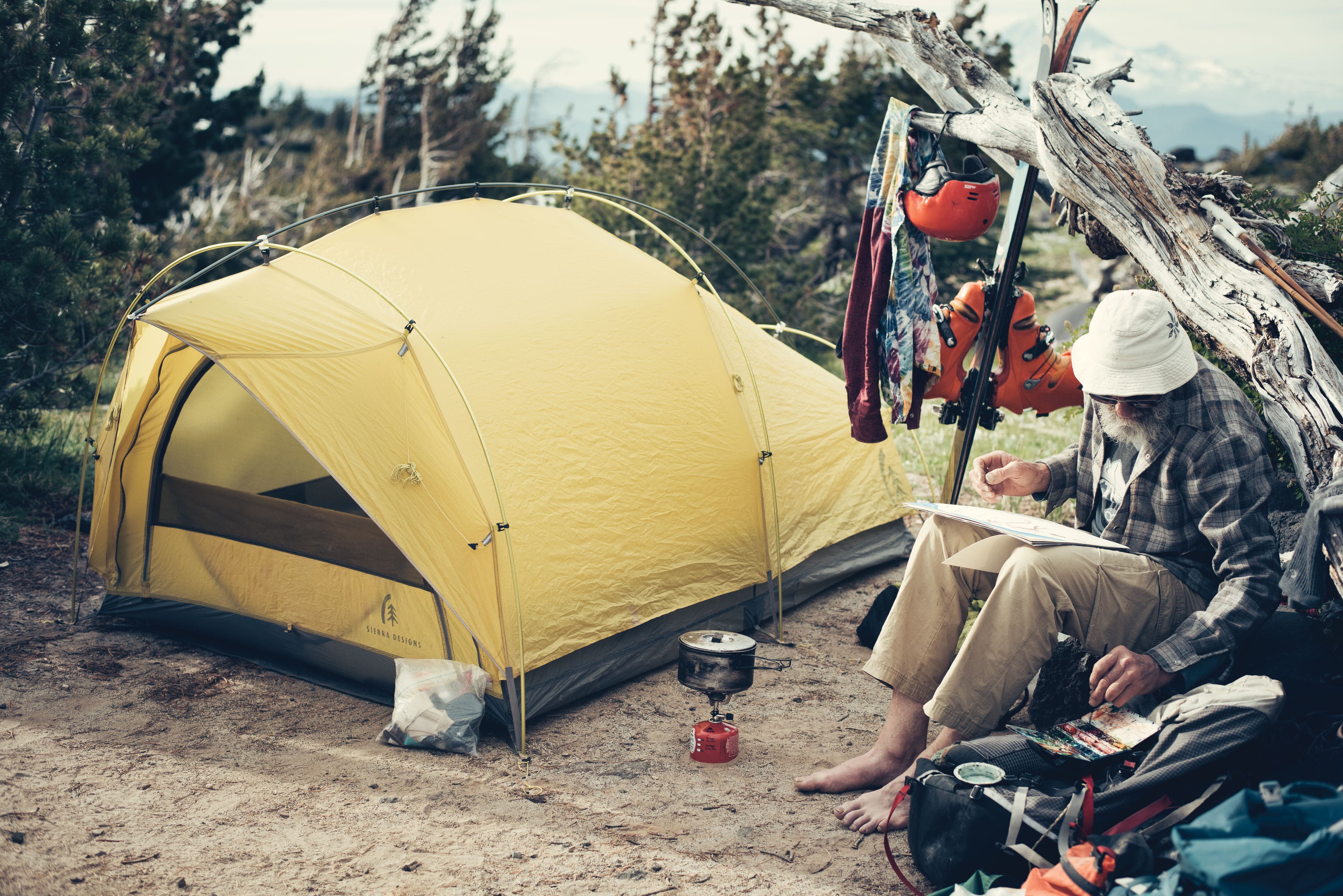 Steve Roberts at camp, painting a portrait of the iconic peak.