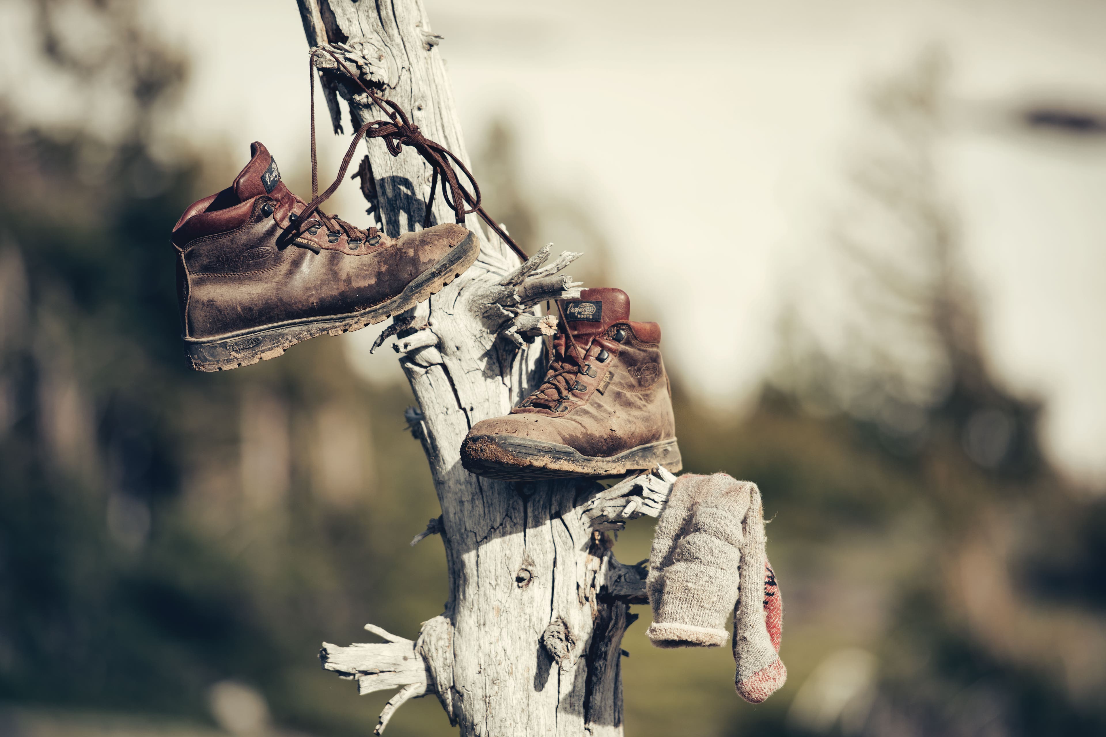 Worn boots hang to dry.