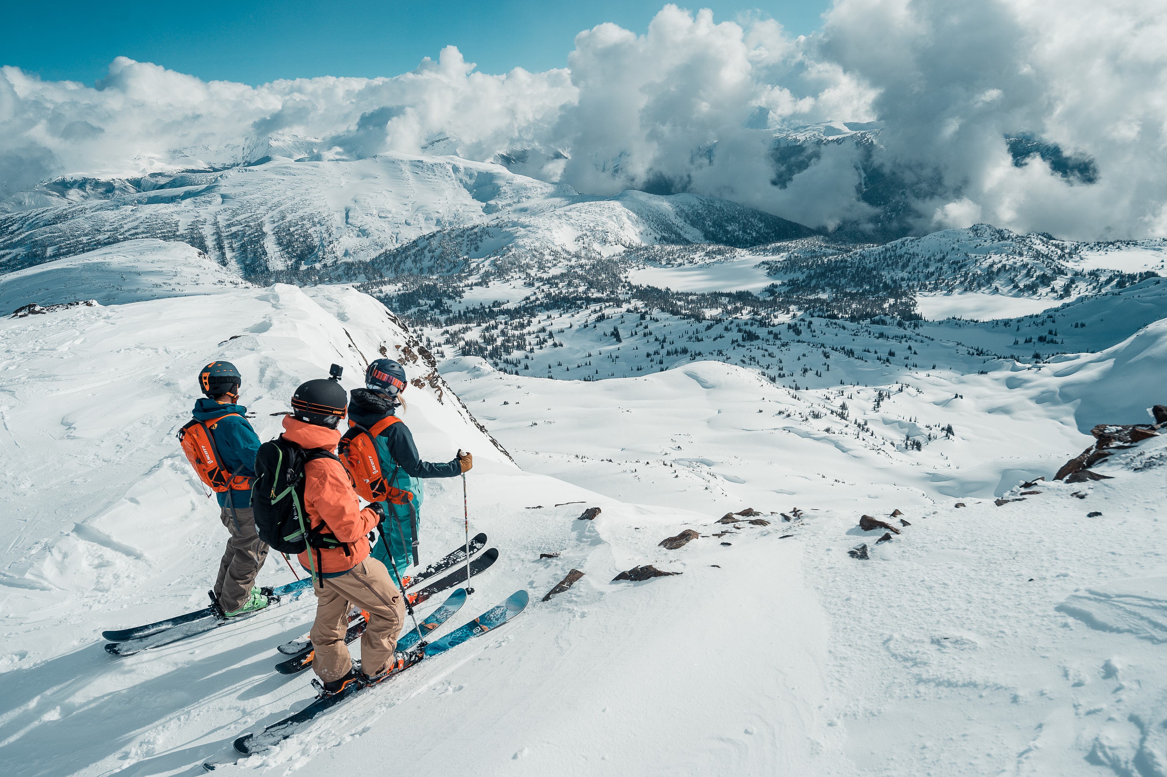 Heli skiers scope their line.