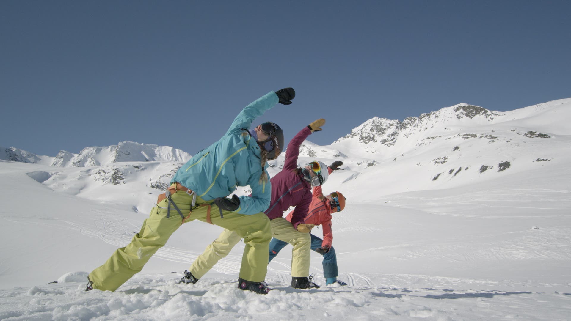 Skiers stretch on snow