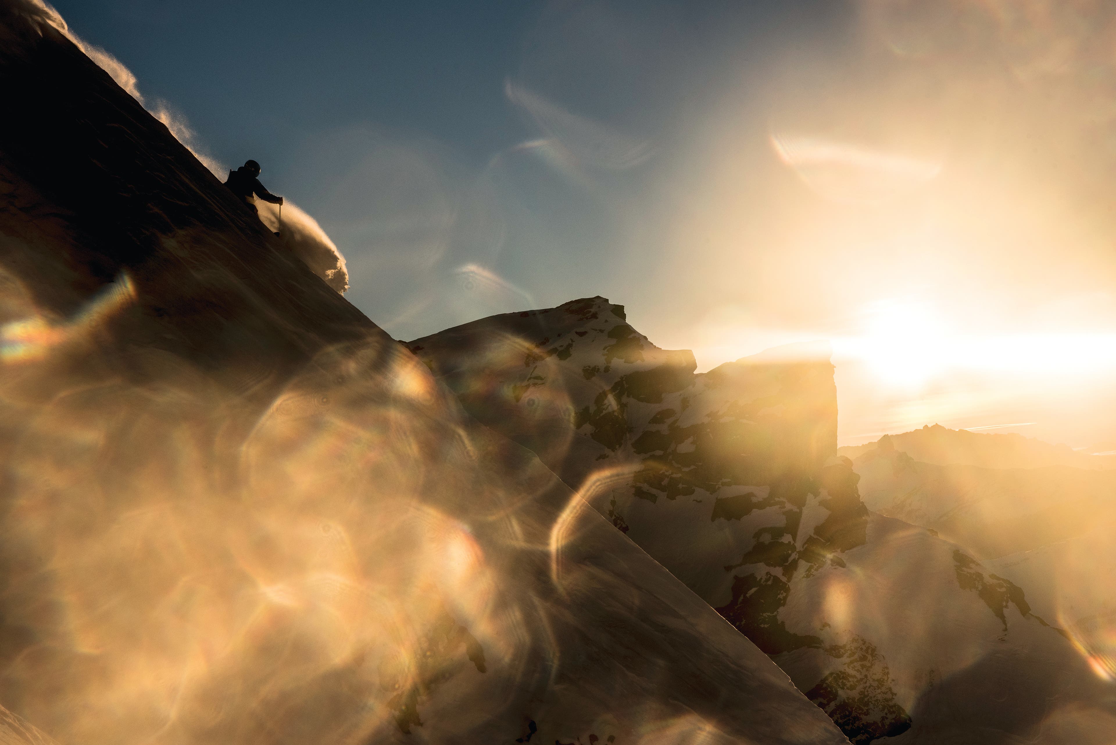 A PLACE IN THE SUN Photographer Guy Fattal and athlete Flo Goeller set out for a simple hike, hoping to see the sun vanish over the peaks outside of…