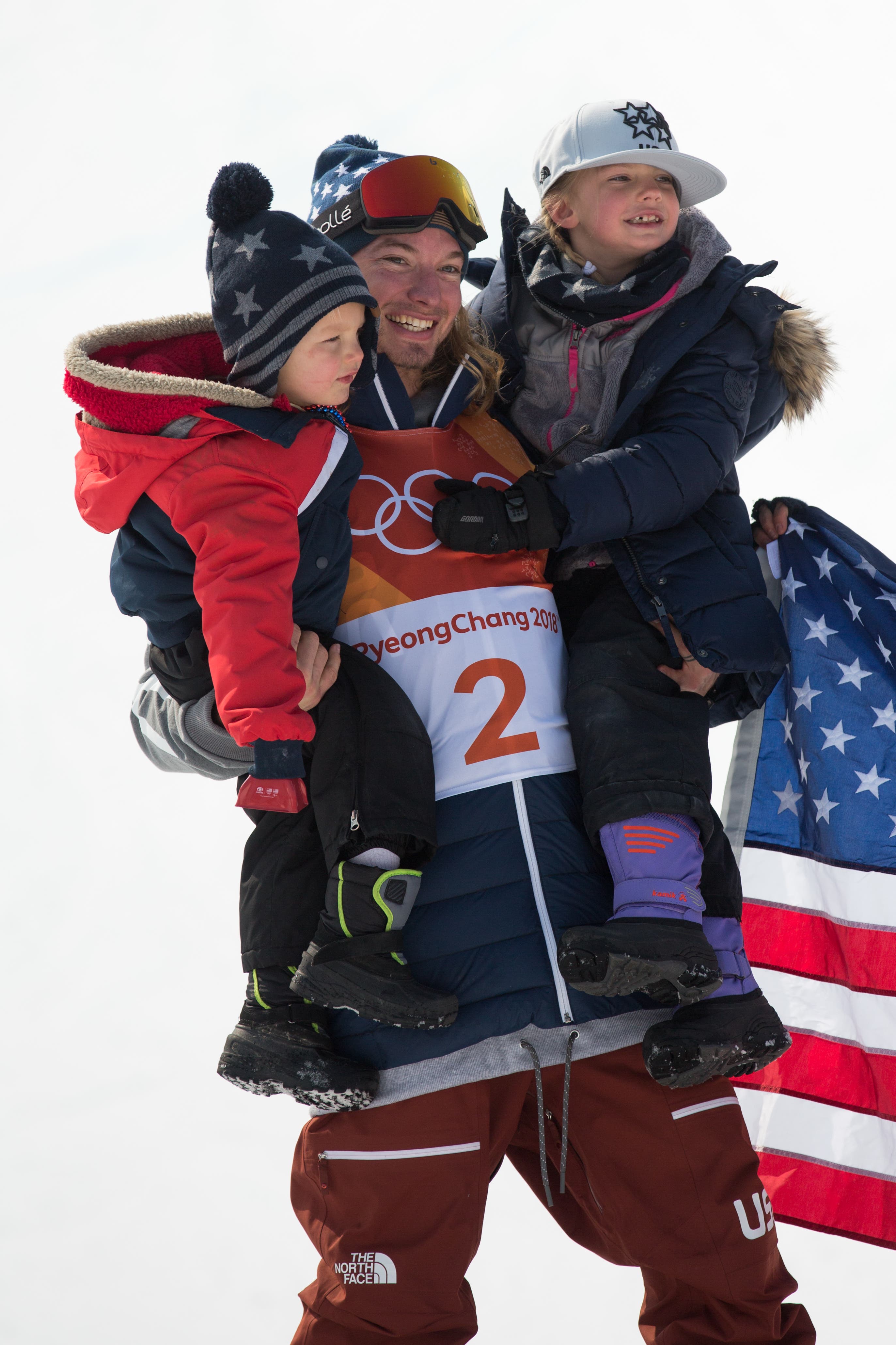 BG5B7047 David Wise celebrates halfpipe win with his children.