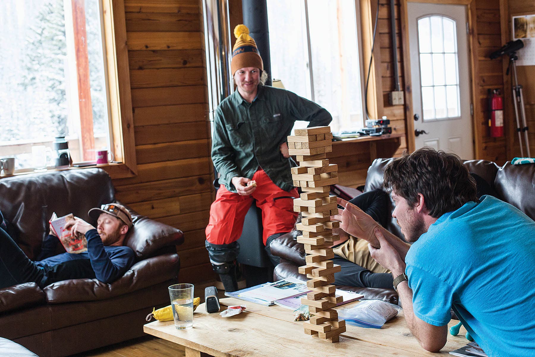The crew unwinds with a game of Jenga.