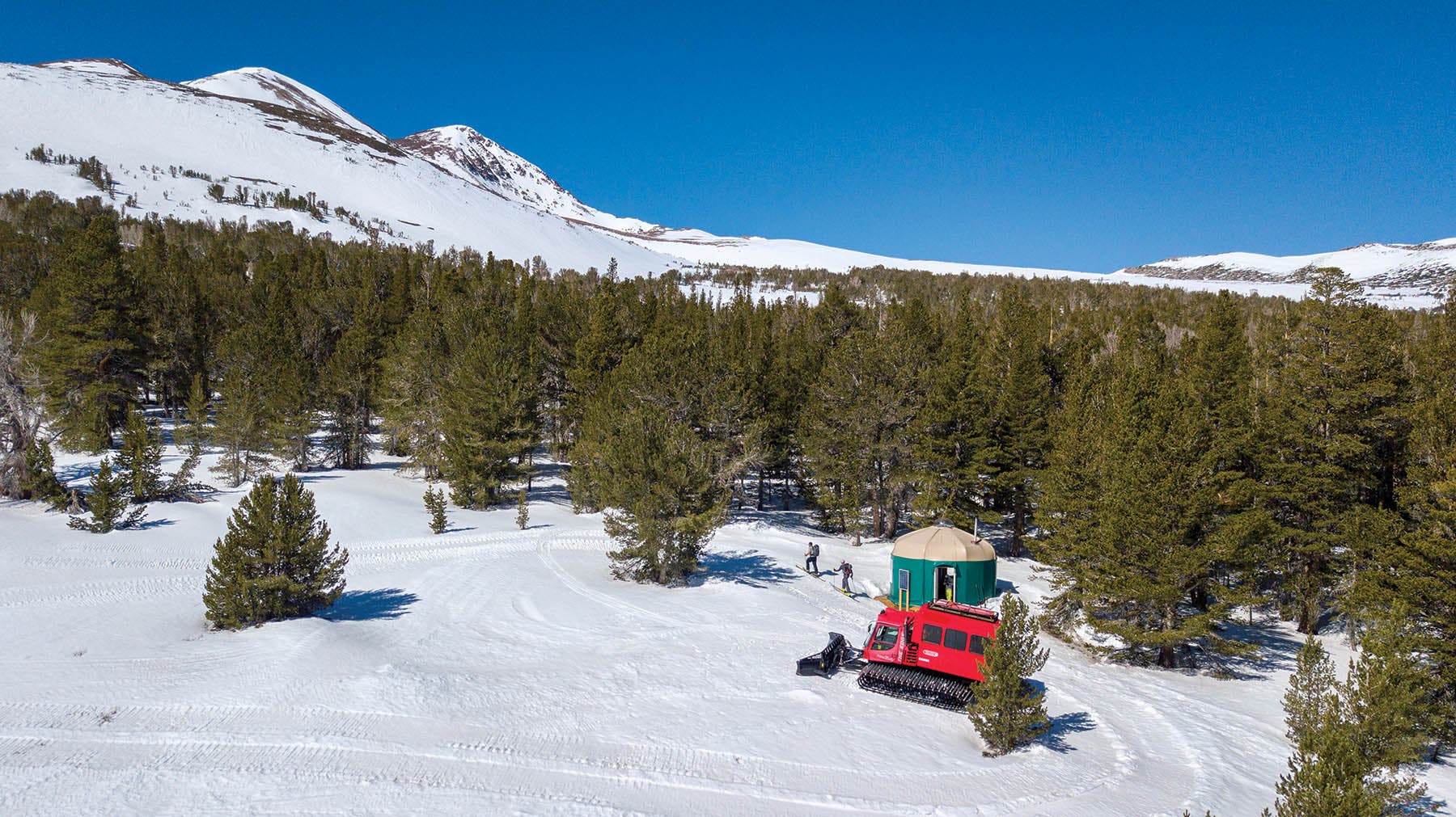 Skiers depart Dunderberg Yurt for the peak of the same name