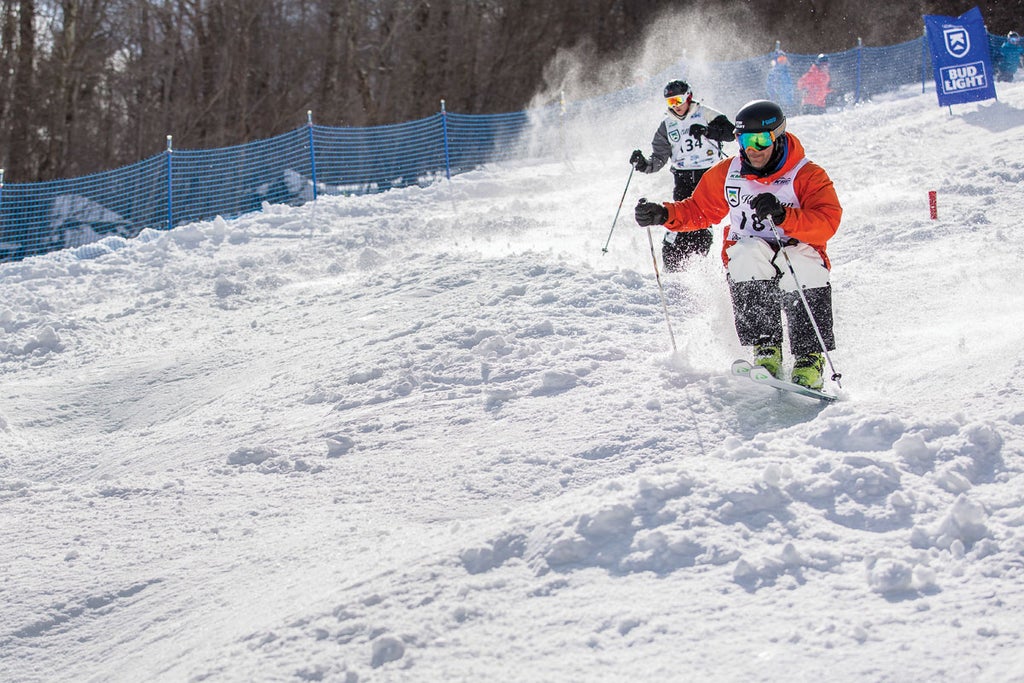 A skier takes on Killington's Bear Mountain Mogul Challenge