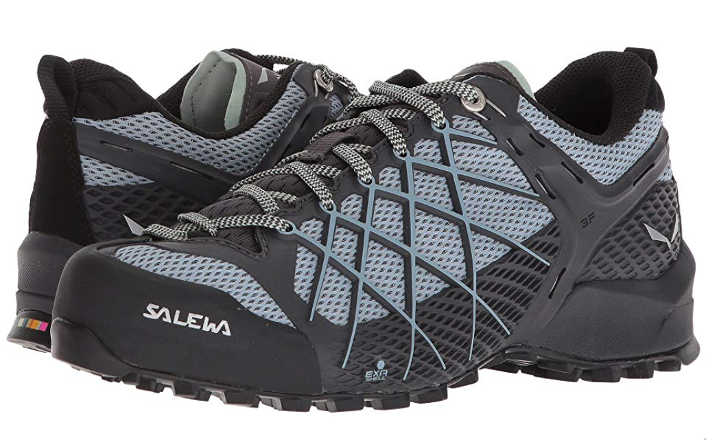 The Salewa Women's Wildfire Approach Shoes offer a climbing zone at the toe, compound rubber sole, large tread lugs, and a breathable footbed.