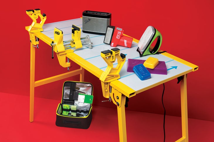 Ski tuning work bench with ski waxing supplies