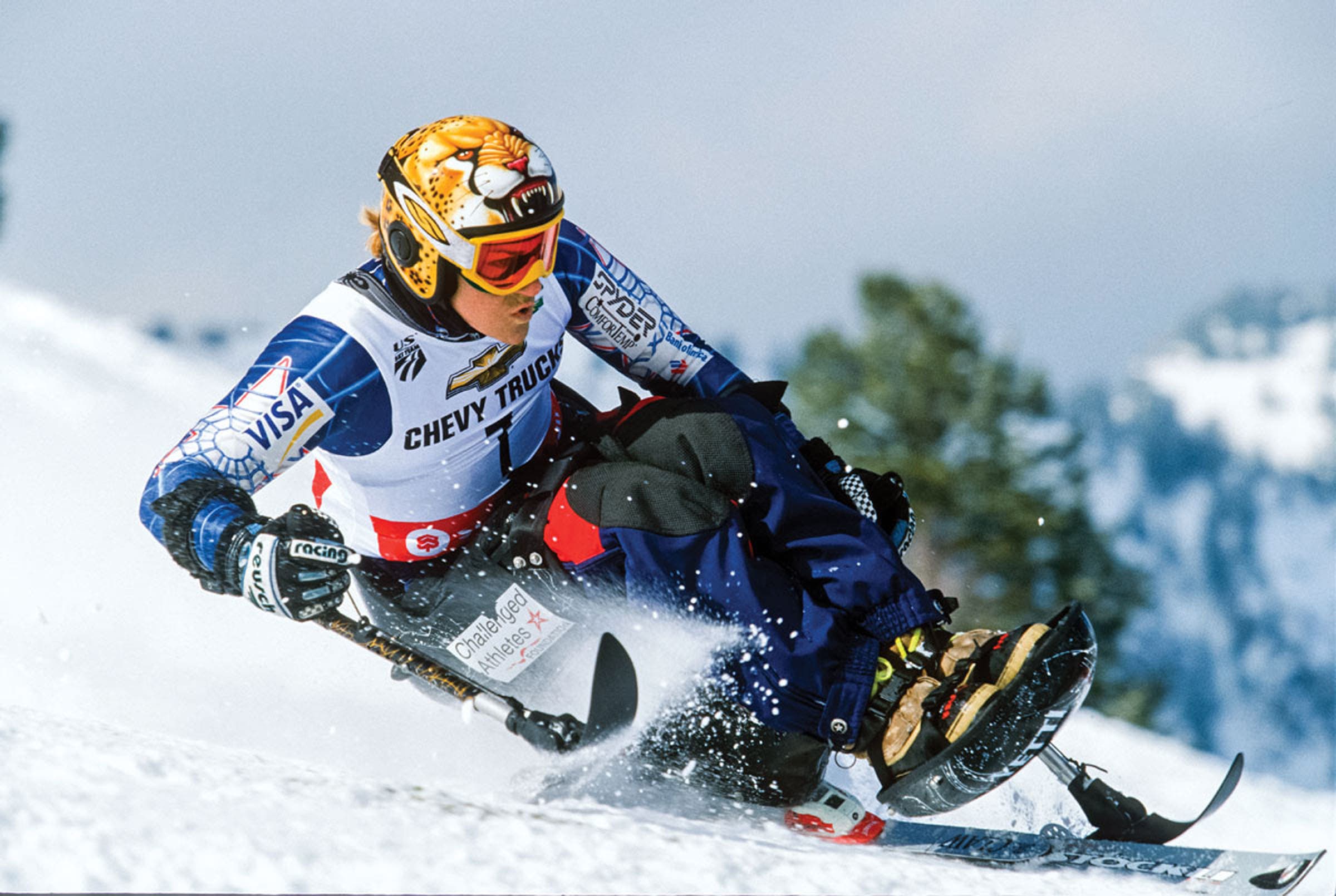 Muffy Davis skiing down slope on a monoski