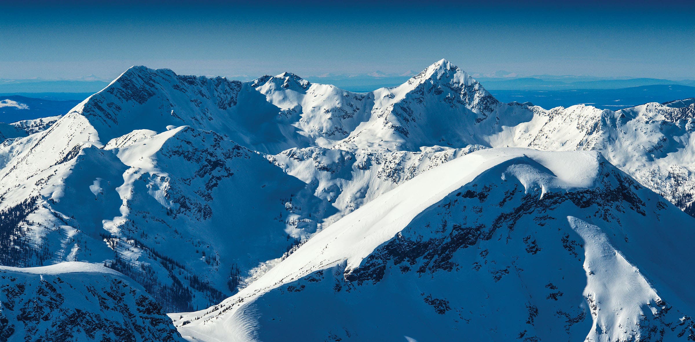 SKI1119-UTL3_SilvertipHeli_ByEricBerger_1 copy Expansive view of the Cariboo Mountains covered in snow