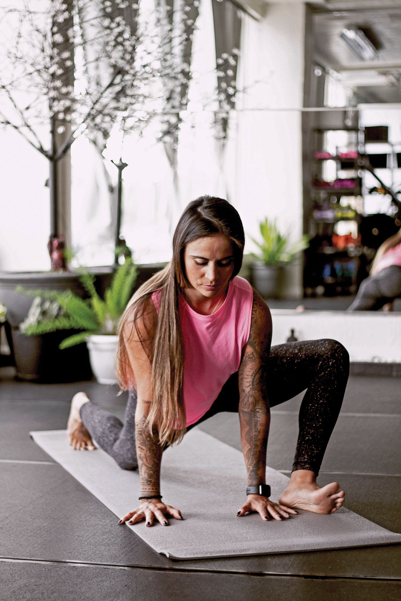 Ashley Battersby performing lizard lunge yoga pose