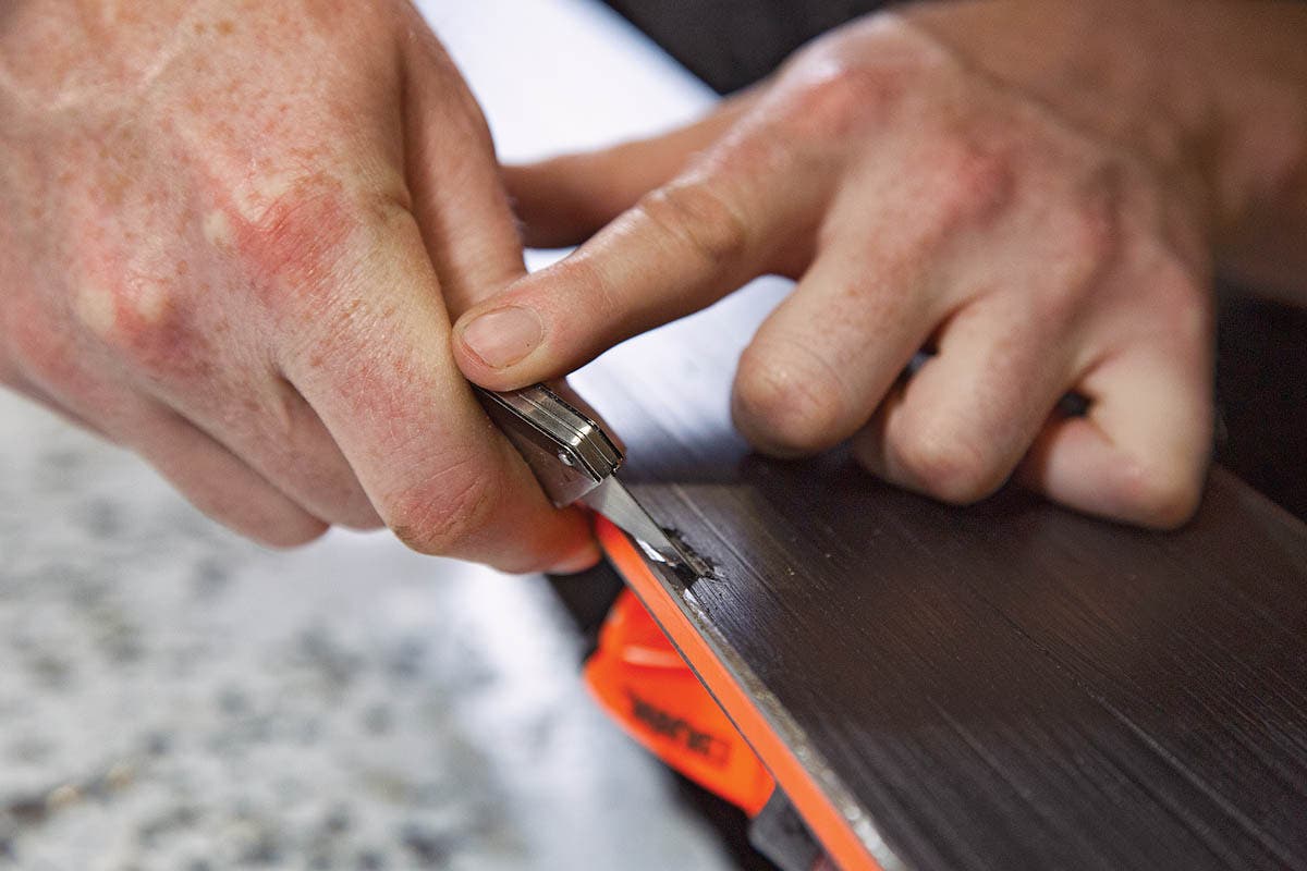 SKI0120-Tuning1-BaseRepair How to repair ski base damage with P-Tex. 1. Use box cutter to trim away damaged base material.