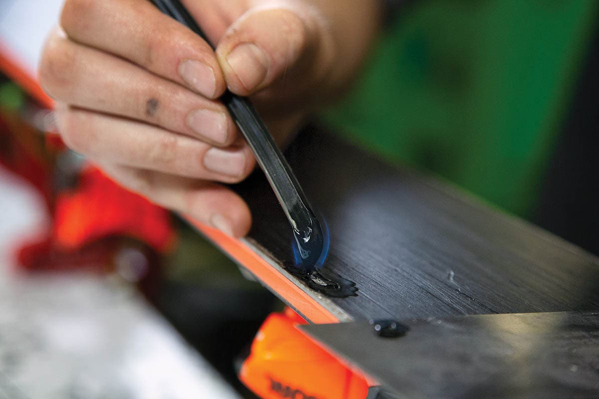 How to repair ski base damage. Step 3: Melt P-Tex over damaged area.