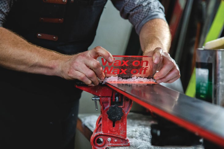 20190417-Tuning-YB0A4532_1 Wax being scraped off skis to shave off excess.