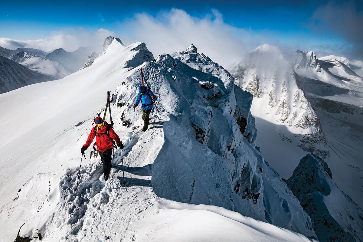 SKI0120-FOC-byMattiasFredriksson_v3 Patrik Strompsten and David Kantermo hiking the ridge on Sweden's 6,240-foot Nipals Peak