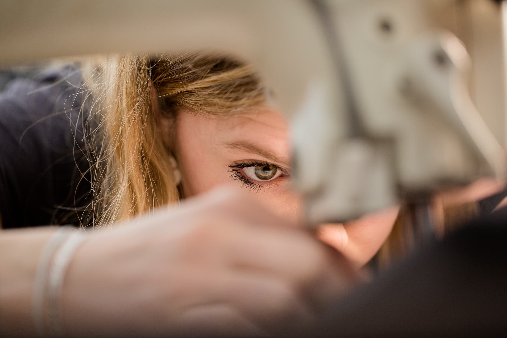 171215_ManufacturingDC_7054-Edit Female manufacturing some Arc'Teryx clothing