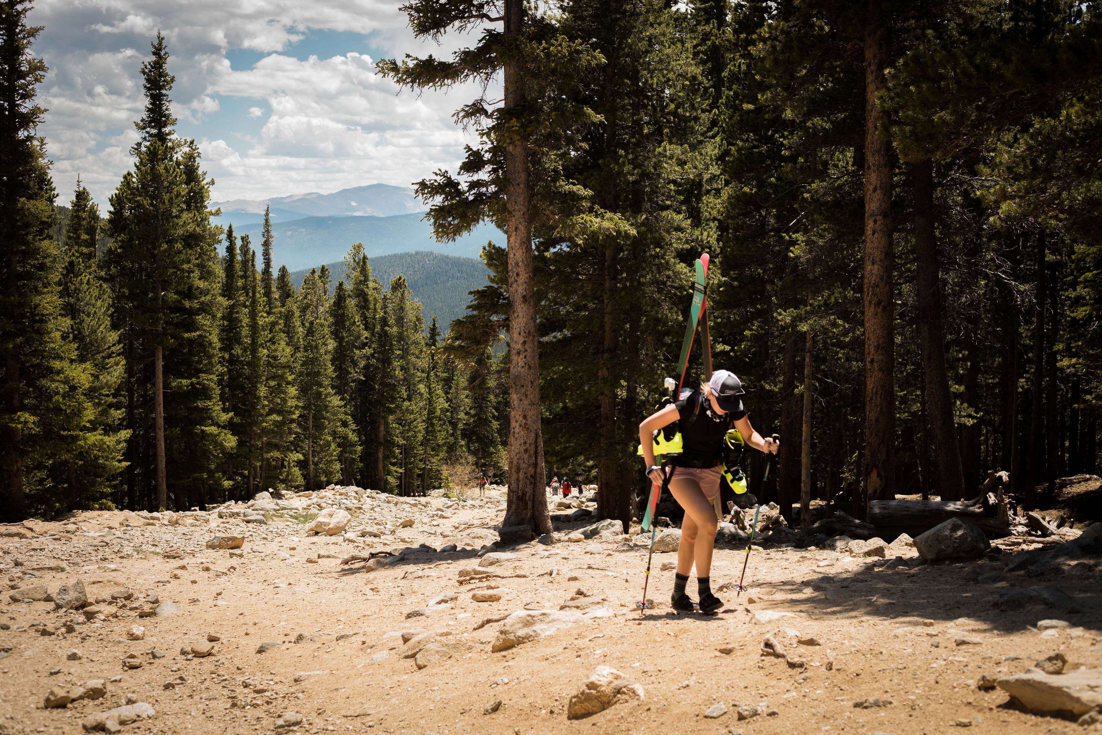 _O5A7955 Maggie hikes from the St. Mary's parking lot to the base of the glacier to ski in June.