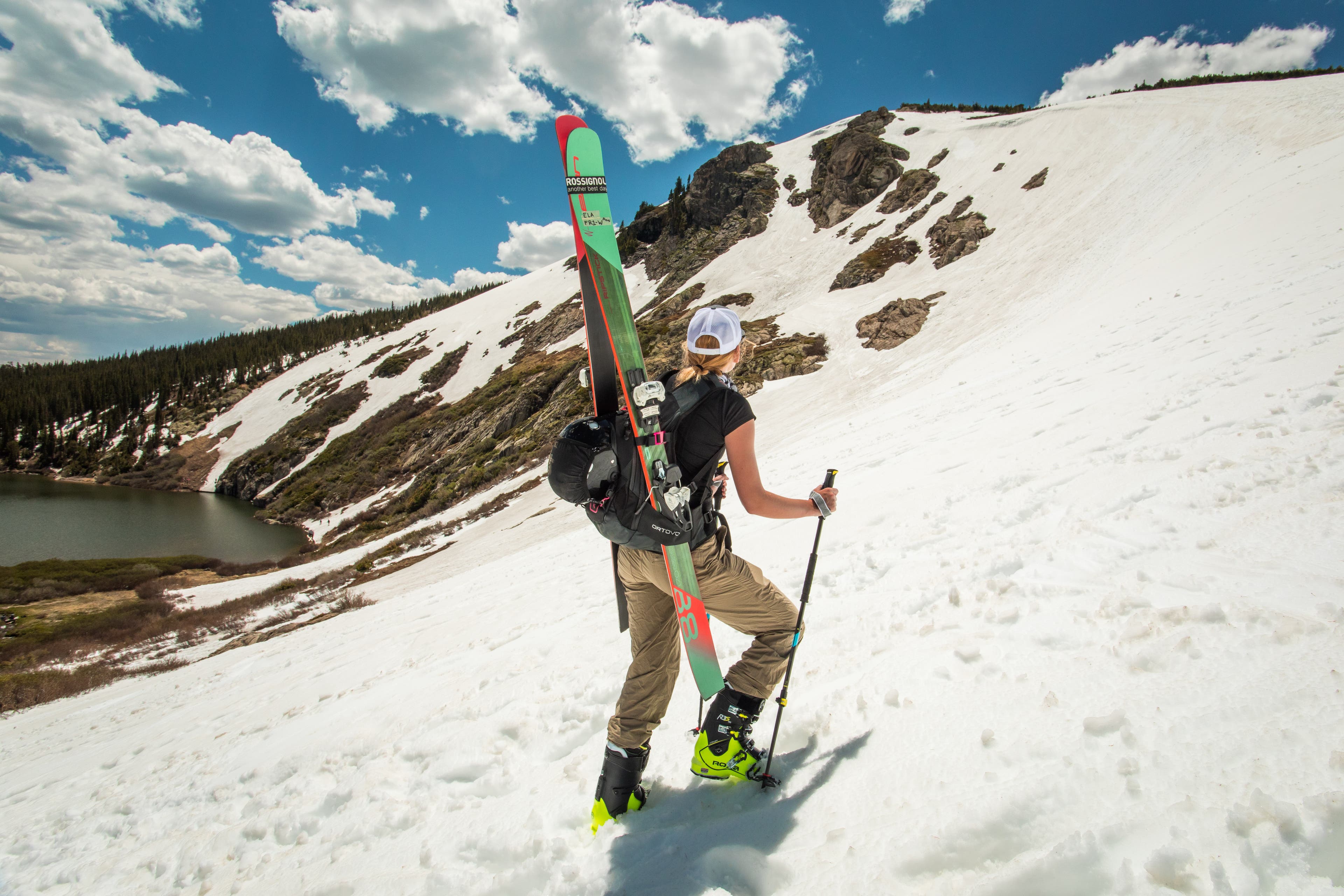 _O5A7981 Maggie looks out over St. Mary's Glacier and lake as she begins her ascent up the snowfield.