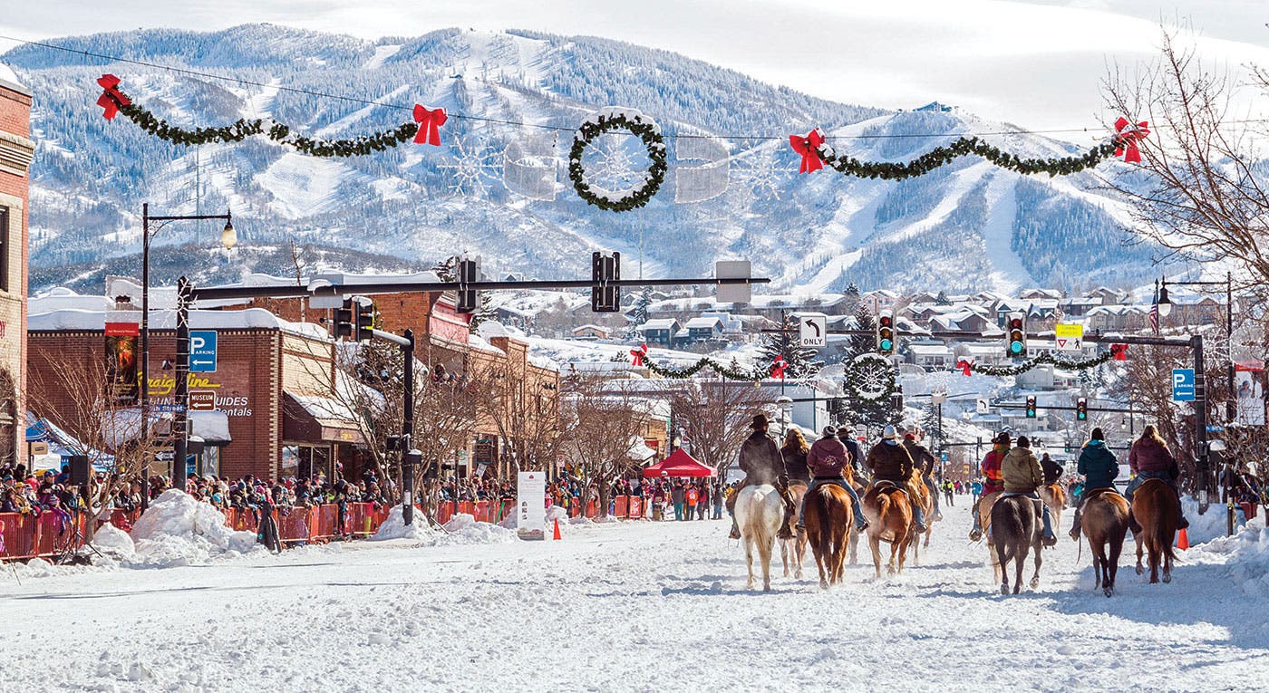 SKI1018-RG-Steamboat-WinterCarnival_1 Horses on Main street in Steamboat, CO