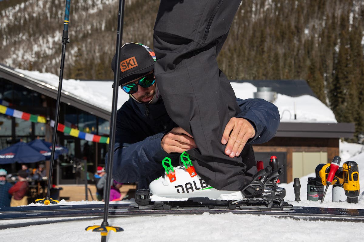 Ski tech adjusting ski binding
