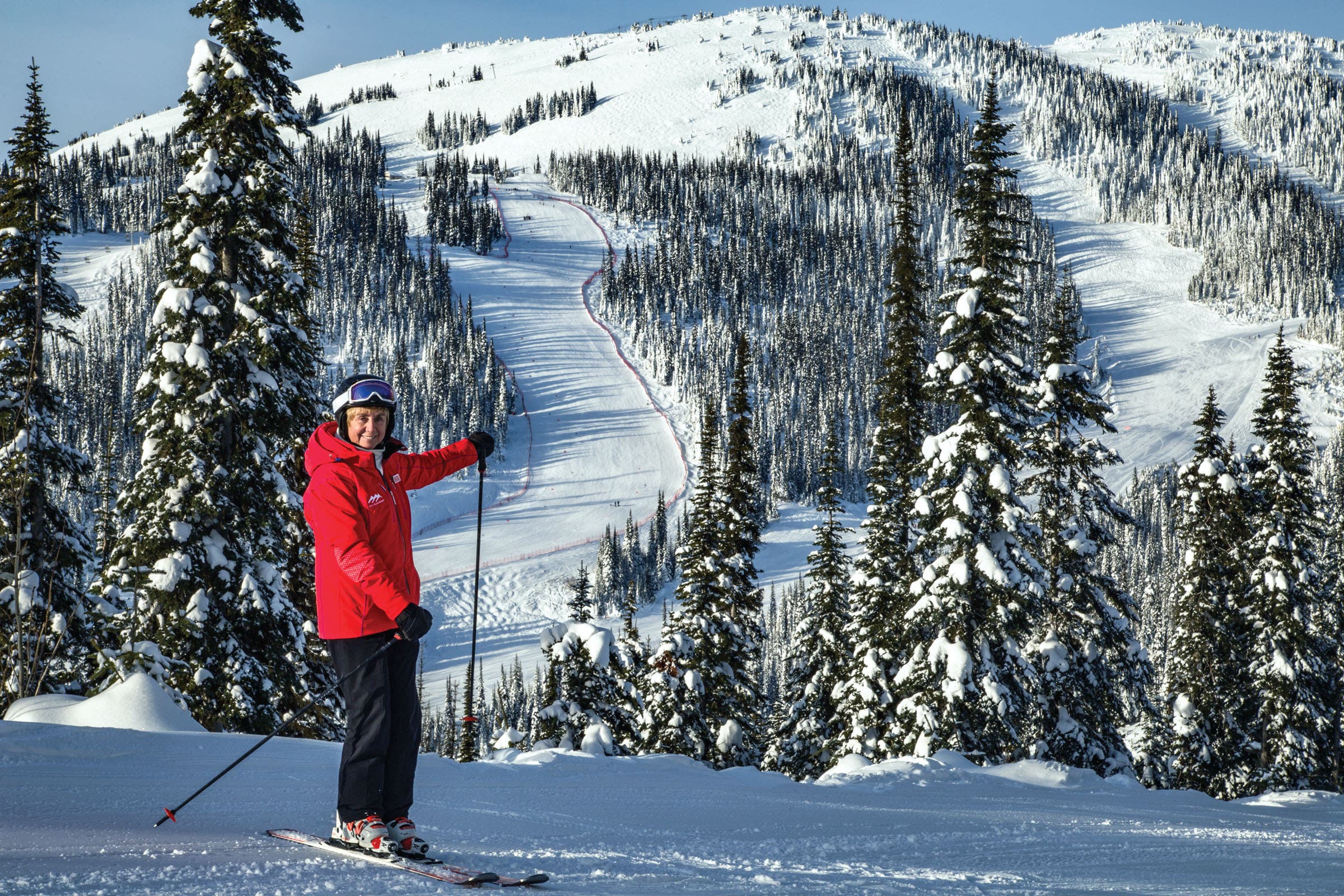 Nancy Greene poses in front of Sun Peak's OSV run