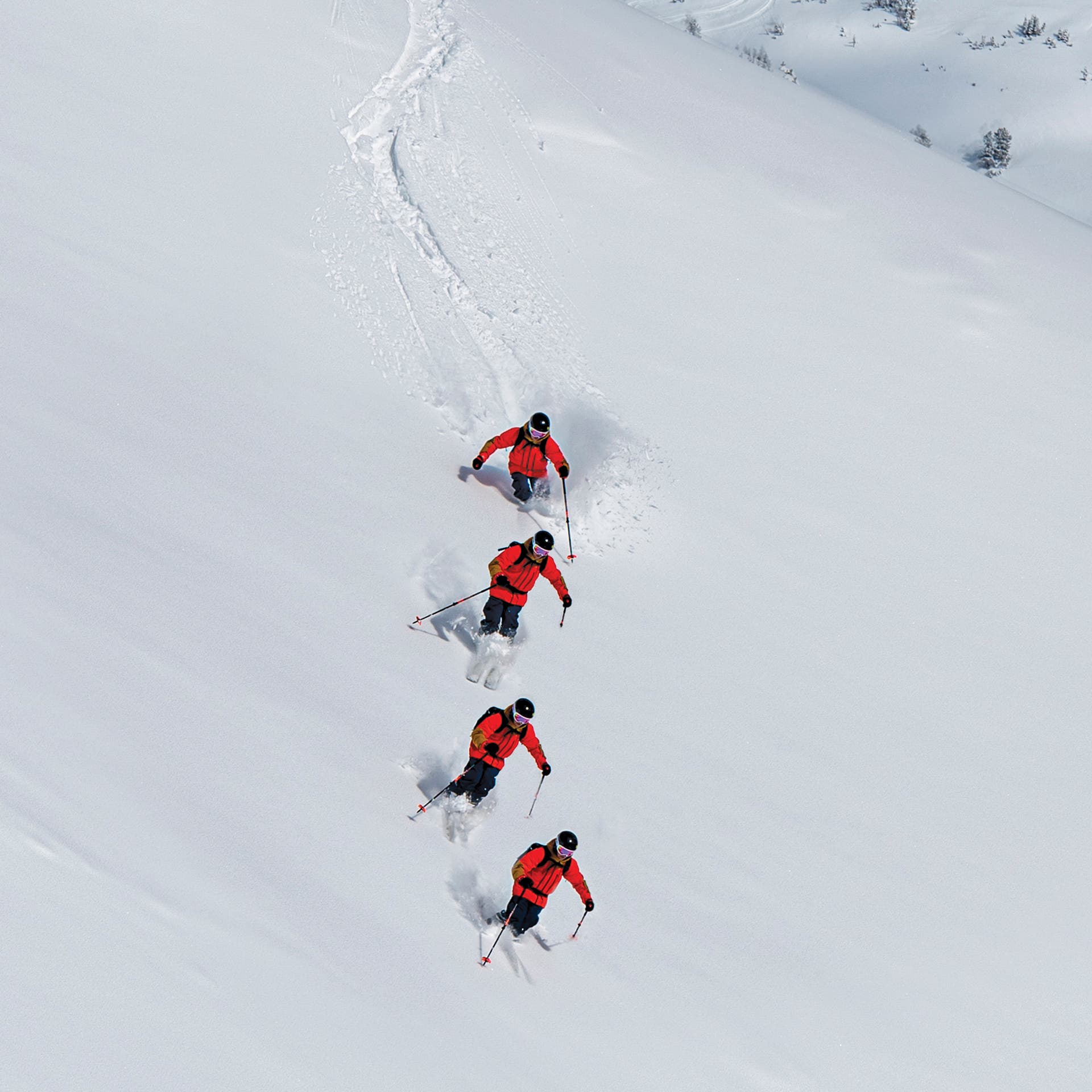 A sequence of a skier skiing in powder