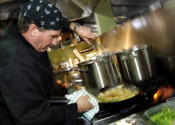 Ken White stands in front of the dam at Falls Creek, Australia. Help Ken and his crew and Donate Here