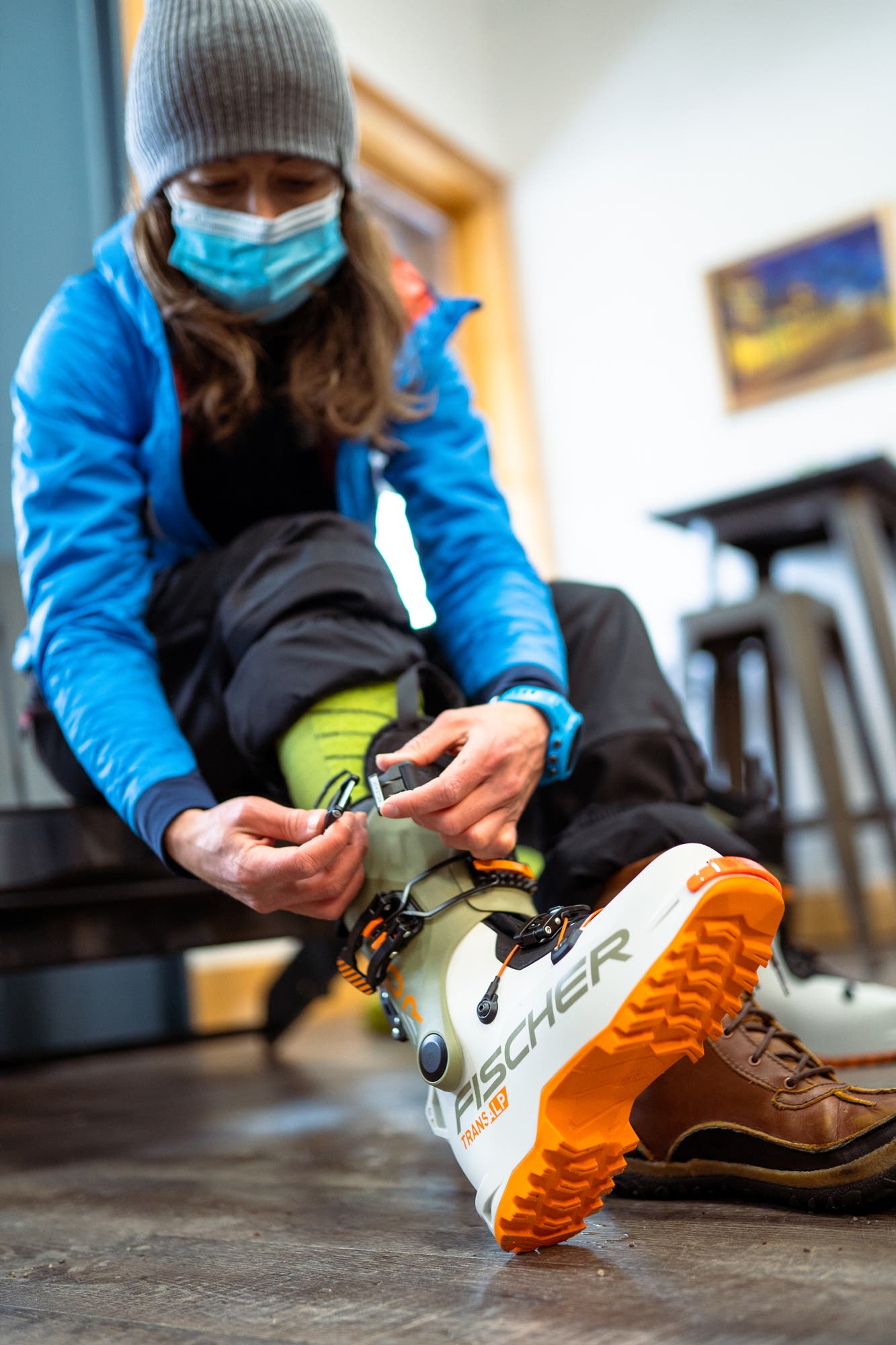 Woman putting on a ski boot