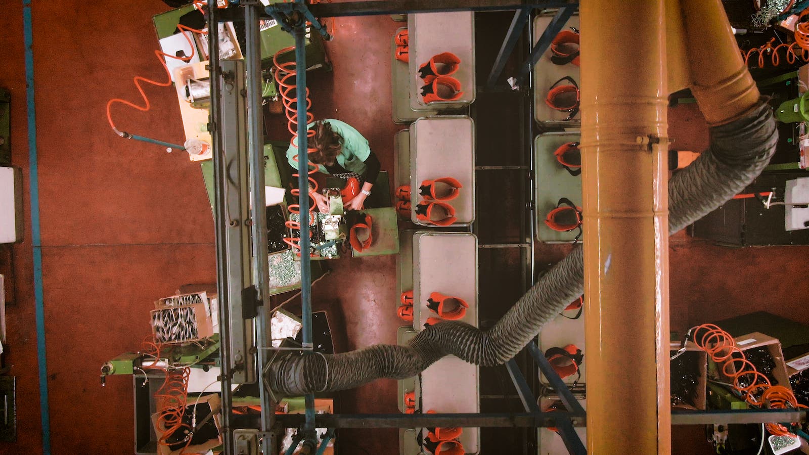 A worker dismantles an old ski boot