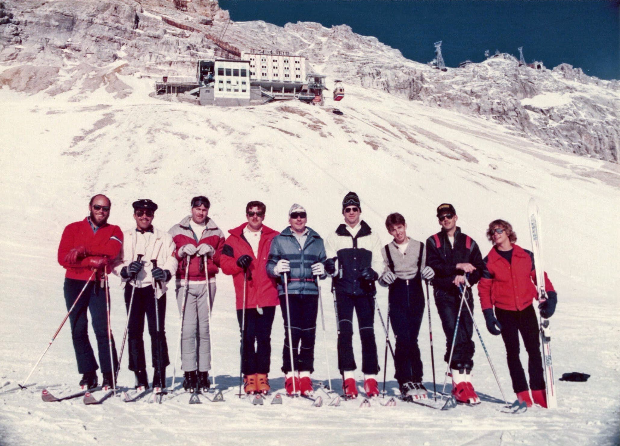 Ski instructor with ski school class on top of the Zugspitze, Germany