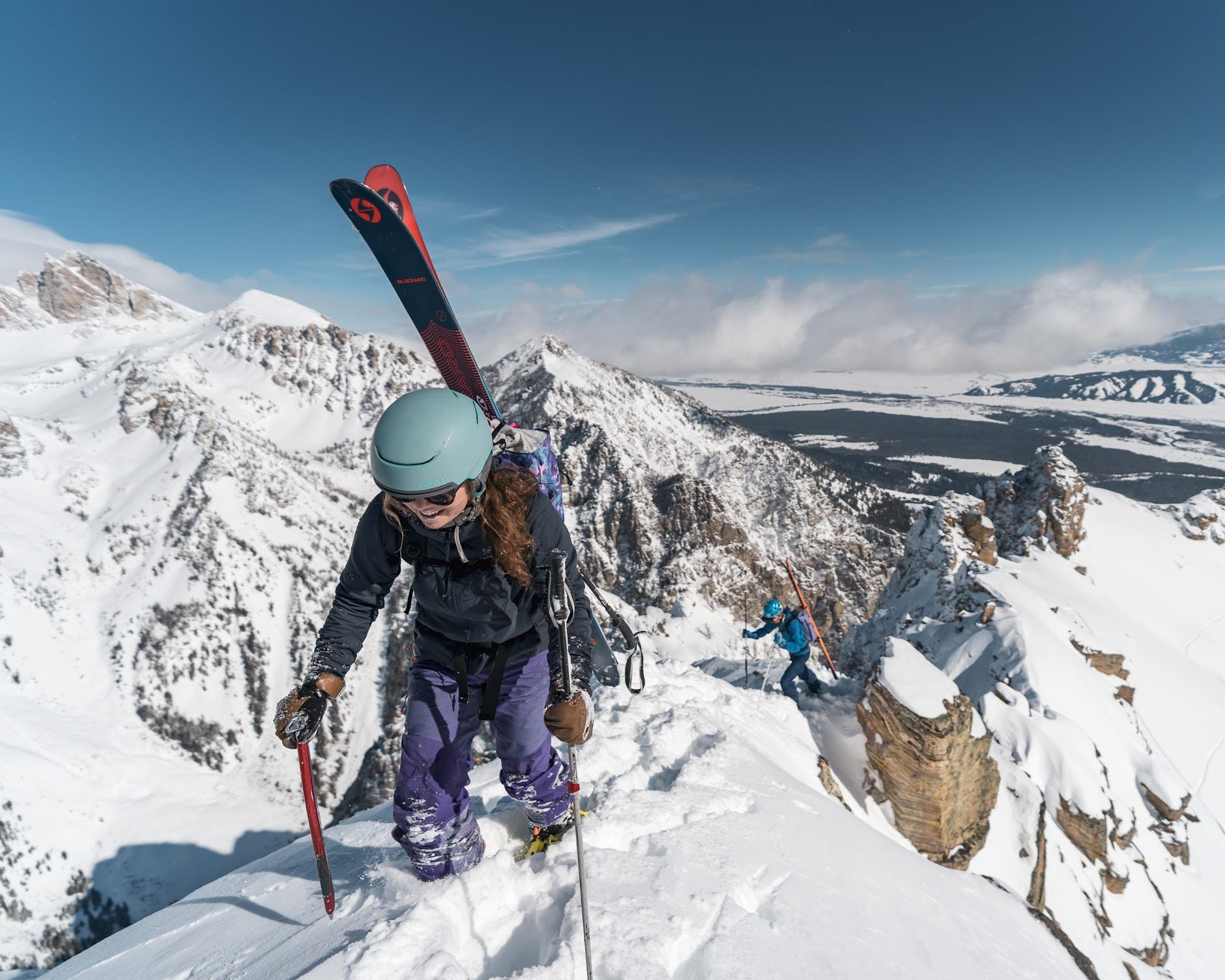 Backcountry skiers navigate a ridge