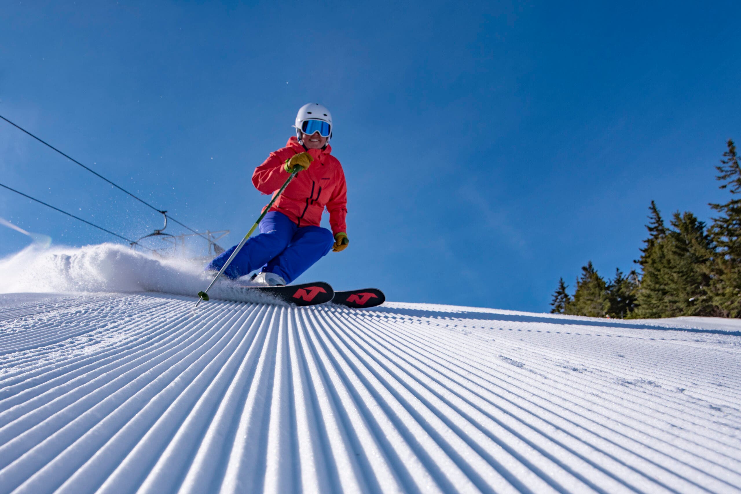 Skier on corduroy at Sunday River