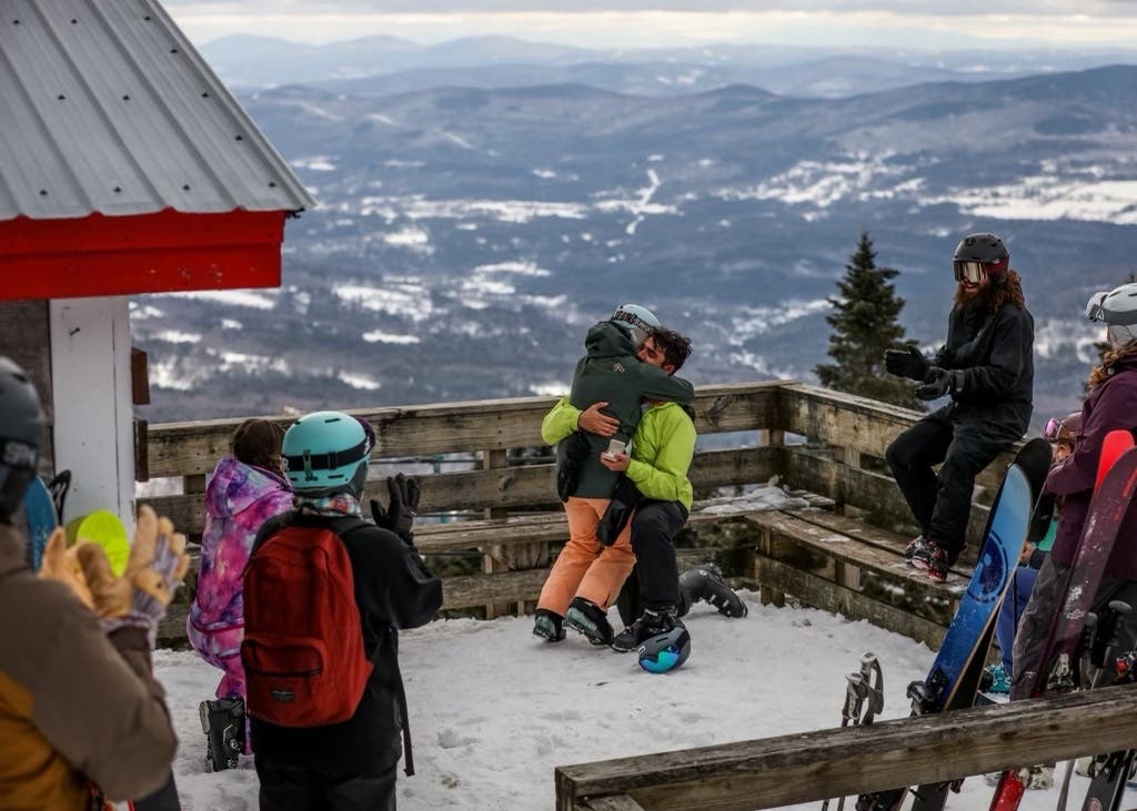 Two people embrace after a proposal