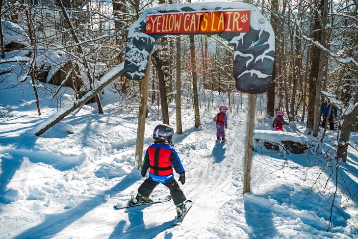 Young skier heads through marked trails at Smugglers' Notch