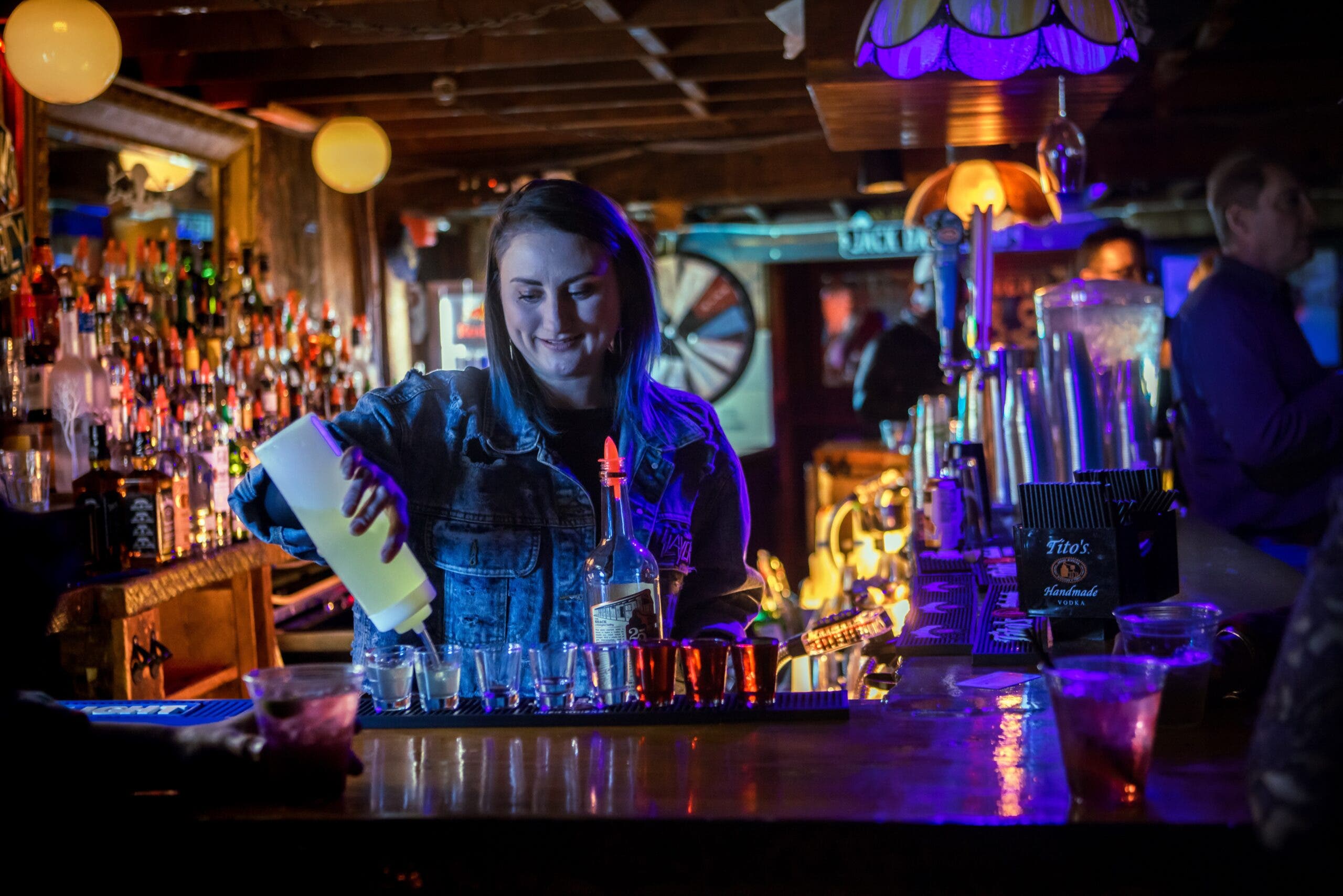 A bar scene under neon lights