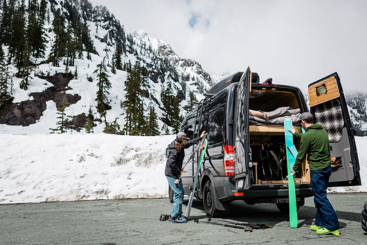 Skiers living out of van in ski area parking lot